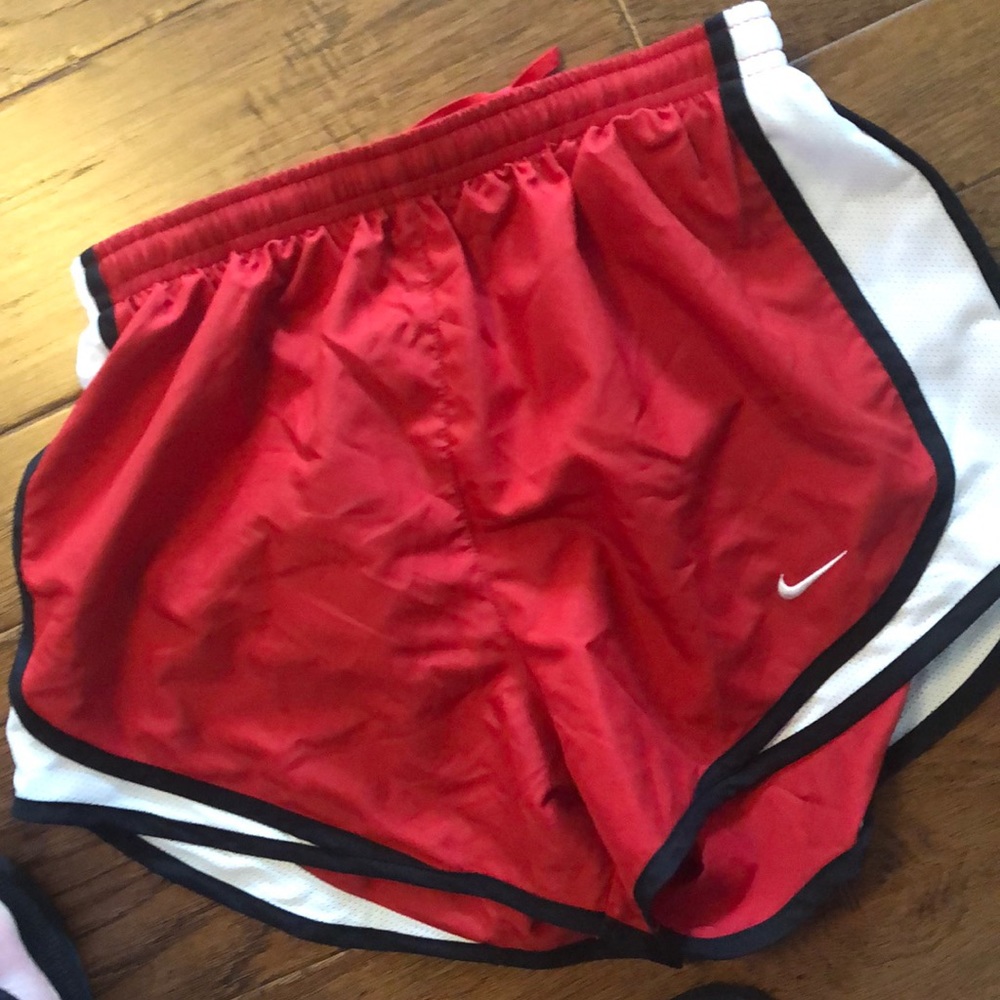Red nike shorts.